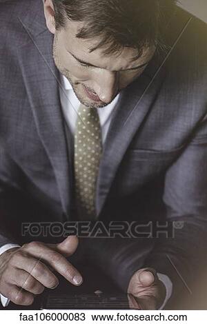 Businessman using digital tablet View Large Photo Image Stock Image - Businessman using digital tablet. Fotosearch