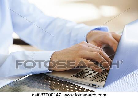 Businessman using laptop computer View Large Photo Image Stock Photo - Businessman using laptop computer. Fotosearch