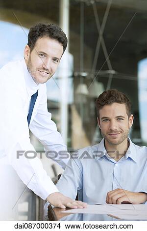 Businessmen in office, portrait View Large Photo Image Picture - Businessmen in office, portrait. Fotosearch
