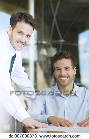 Businessmen in office, portrait View Large Photo Image Stock Image - Businessmen in office, portrait. Fotosearch
