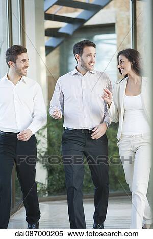 Businesswoman sharing idea with associates View Large Photo Image Stock Photography - Businesswoman sharing idea with associates. Fotosearch
