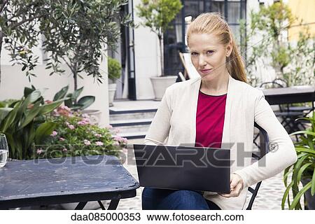 Businesswoman using laptop computer View Large Photo Image Stock Image - Businesswoman using laptop computer. Fotosearch