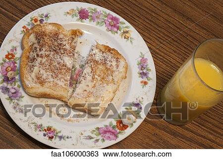 Buttered toast and orange juice View Large Photo Image Stock Image - Buttered toast and orange juice. Fotosearch