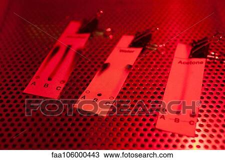 Chemical test strips illuminated by red light View Large Photo Image Stock Image - Chemical test strips illuminated by red light. Fotosearch