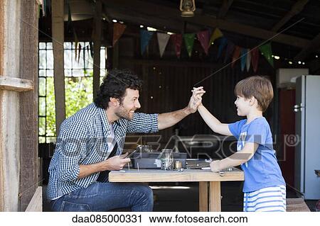 Stock Image - Child and father bonding. Fotosearch