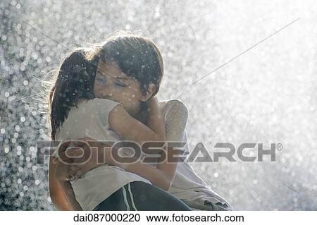 Children embracing outdoors View Large Photo Image Stock Image - Children embracing outdoors. Fotosearch