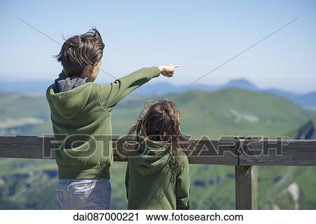 Children looking at mountain view View Large Photo Image Stock Image - Children looking at mountain view. Fotosearch