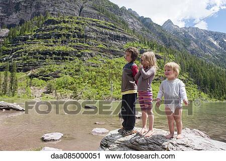 Children playing on rock in Glacier National Park, Montana, USA View Large Photo Image Stock Image - Children playing on rock in Glacier National Park, Montana, USA. Fotosearch