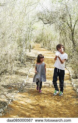 Children walking together on path View Large Photo Image Stock Photo - Children walking together on path. Fotosearch