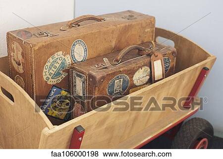 Child's wagon carrying antique suitcases View Large Photo Image Stock Photo - Child's wagon carrying antique suitcases. Fotosearch