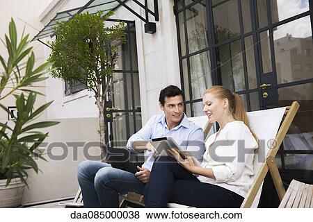 Colleagues meeting informally during business trip View Large Photo Image Stock Photo - Colleagues meeting informally during business trip. Fotosearch