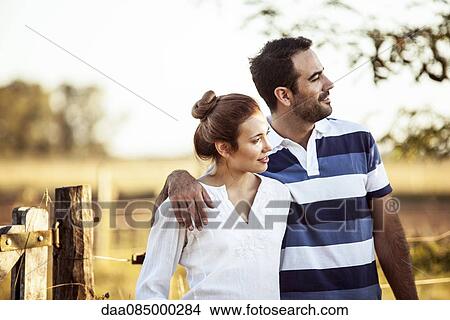 Couple admiring view of countryside View Large Photo Image Picture - Couple admiring view of countryside. Fotosearch