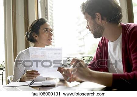 Couple discussing family financial issues View Large Photo Image Stock Image - Couple discussing family financial issues. Fotosearch