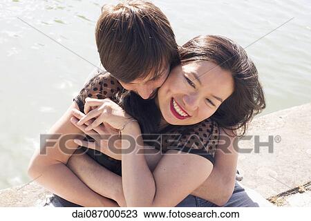 Couple embracing outdoors View Large Photo Image Stock Image - Couple embracing outdoors. Fotosearch