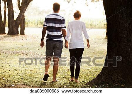 Stock Photography - Couple enjoying outdoors together. Fotosearch