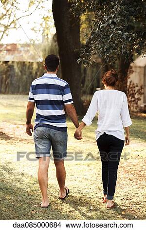 Couple going on walk together View Large Photo Image Picture - Couple going on walk together. Fotosearch
