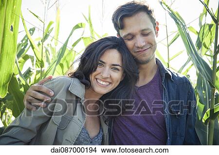 Couple relaxing together outdoors, portrait View Large Photo Image Picture - Couple relaxing together outdoors, portrait. Fotosearch