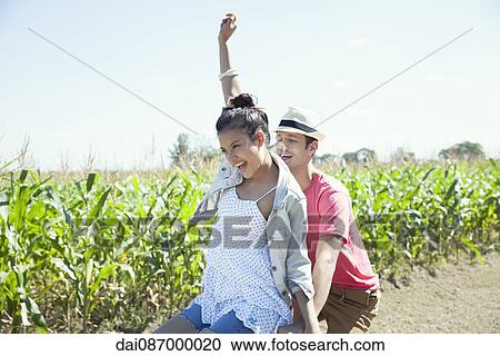 Couple riding bike together View Large Photo Image Stock Image - Couple riding bike together. Fotosearch
