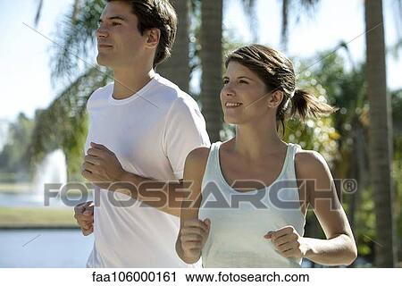 Couple running together View Large Photo Image Stock Image - Couple running together. Fotosearch