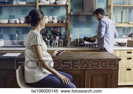 Couple together at home in kitchen View Large Photo Image Stock Photography - Couple together at home in kitchen. Fotosearch