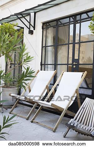 Deckchairs on residential terrace View Large Photo Image Stock Photo - Deckchairs on residential terrace. Fotosearch