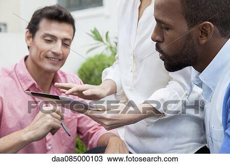 Digital tablets are valuable tools for sharing information in workplace View Large Photo Image Stock Image - Digital tablets are valuable tools for sharing information in workplace. Fotosearch