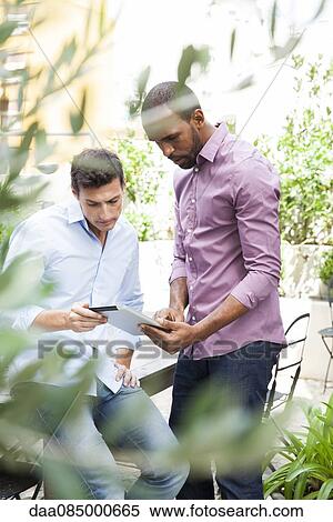Digital tablets make collaboration mobile View Large Photo Image Stock Photography - Digital tablets make collaboration mobile. Fotosearch