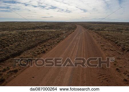 Dirt road through arid landscape View Large Photo Image Picture - Dirt road through arid landscape. Fotosearch