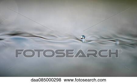 Droplet on water surface View Large Photo Image Stock Photo - Droplet on water surface. Fotosearch