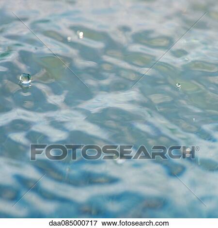 Droplets on water surface View Large Photo Image Stock Photo - Droplets on water surface. Fotosearch