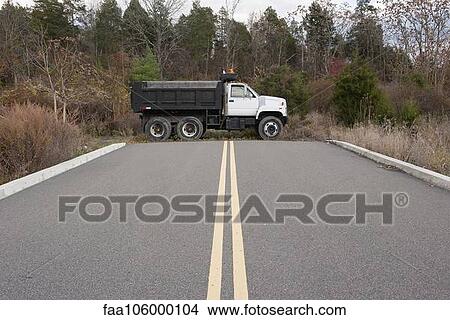 Dump truck parked at dead end on road View Large Photo Image Picture - Dump truck parked at dead end on road. Fotosearch
