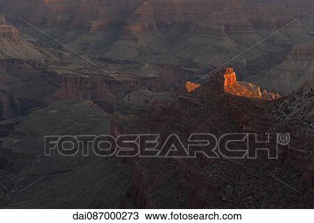 Evening sunlight illuminates a rock formation in the Grand Canyon, Arizona, USA View Large Photo Image Stock Image - Evening sunlight illuminates a rock formation in the Grand Canyon, Arizona, USA. Fotosearch