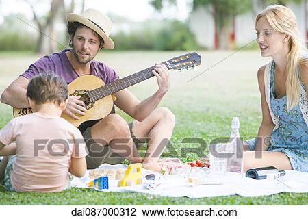 Family enjoying family time in backyard View Large Photo Image Stock Image - Family enjoying family time in backyard. Fotosearch