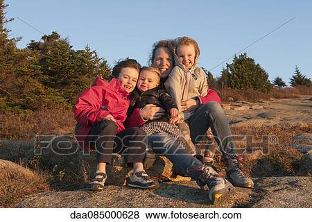Stock Photo - Family on vacation, portrait. Fotosearch