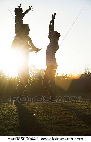 Family spending time outdoors together, father carrying little boy on shoulders View Large Photo Image Stock Image - Family spending time outdoors together, father carrying little boy on shoulders. Fotosearch