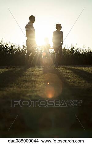 Family with little boy enjoying great outdoors View Large Photo Image Picture - Family with little boy enjoying great outdoors. Fotosearch