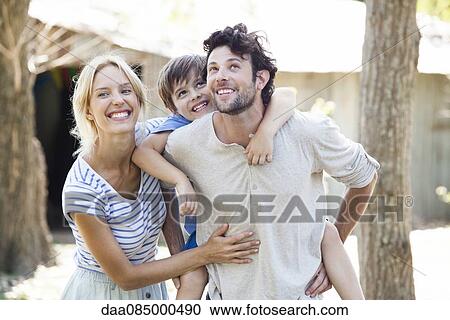 Stock Image - Family with one child, portrait. Fotosearch