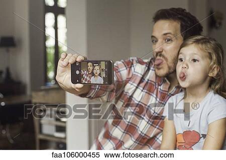 Father and daughter making funny faces selfie View Large Photo Image Stock Photography - Father and daughter making funny faces selfie. Fotosearch