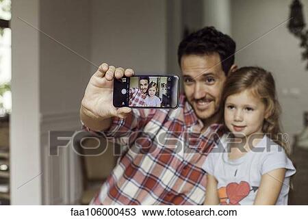 Father and daughter posing for selfie View Large Photo Image Stock Image - Father and daughter posing for selfie. Fotosearch