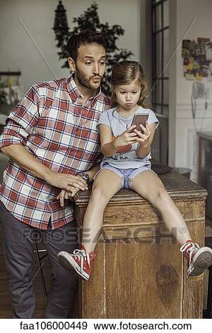 Father and daughter posing for selfie View Large Photo Image Stock Photo - Father and daughter posing for selfie. Fotosearch