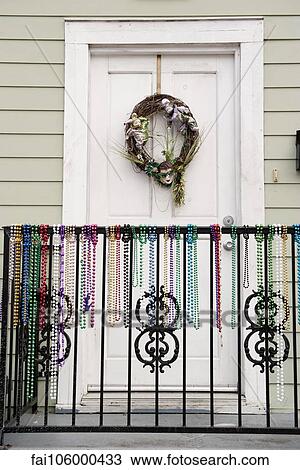 Festive wreath and mardi gras beads on entrance to home View Large Photo Image Stock Image - Festive wreath and mardi gras beads on entrance to home. Fotosearch