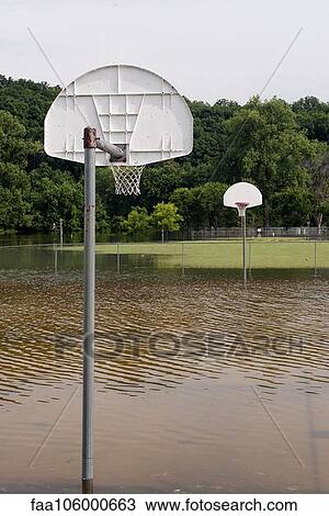 Flooded outdoor basketball court View Large Photo Image Stock Image - Flooded outdoor basketball court. Fotosearch