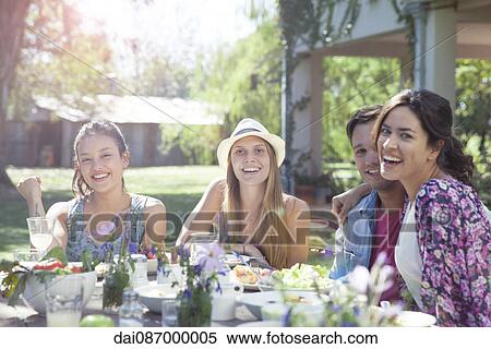 Friends bonding during weekend meal together, portrait View Large Photo Image Stock Photography - Friends bonding during weekend meal together, portrait. Fotosearch