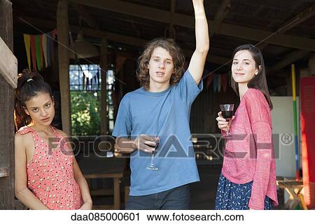 Friends hangng out together drinking wine View Large Photo Image Stock Image - Friends hangng out together drinking wine. Fotosearch