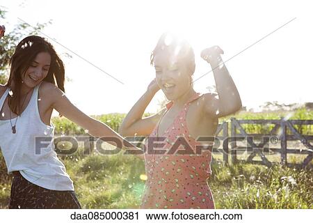 Friends spending carefree day together outdoors View Large Photo Image Stock Image - Friends spending carefree day together outdoors. Fotosearch