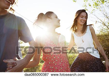 Friends spending summer day together outdoors View Large Photo Image Stock Photo - Friends spending summer day together outdoors. Fotosearch