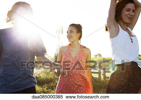 Friends spending time together outdoors View Large Photo Image Stock Photography - Friends spending time together outdoors. Fotosearch