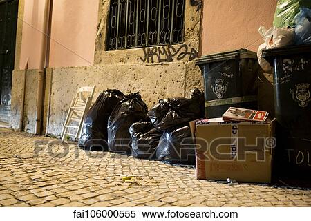 Stock Photography - Garbage at side of building. Fotosearch