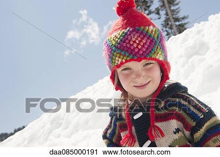 Girl playing in snow, portrait View Large Photo Image Stock Image - Girl playing in snow, portrait. Fotosearch
