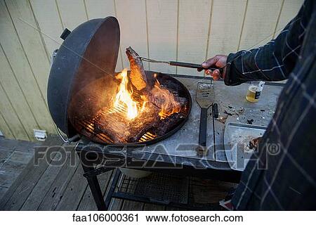 Grilling steaks View Large Photo Image Stock Image - Grilling steaks. Fotosearch